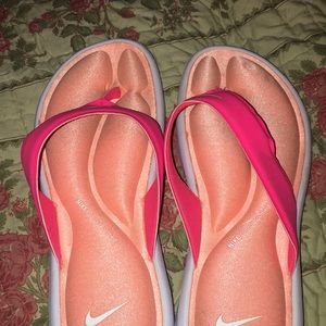 Flip flops.. Nike